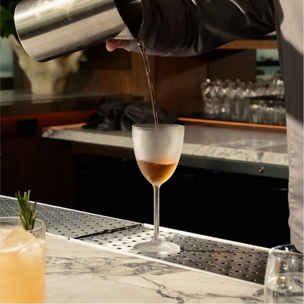 Craft cocktail bar at Dunya Lounge with signature drinks and warm lighting