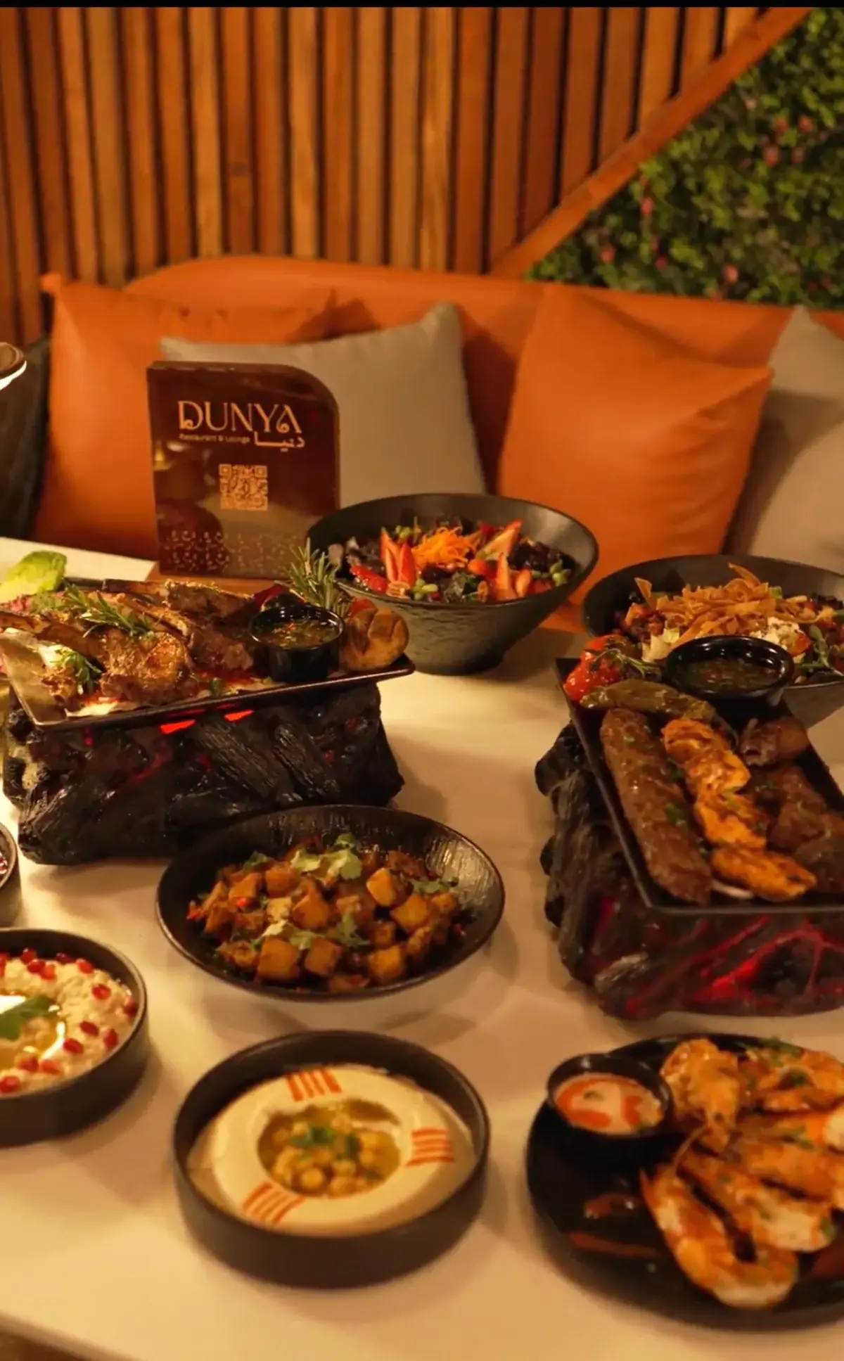 Full Levantine mezze spread at Dunya Lounge with hummus, grilled meats and salads