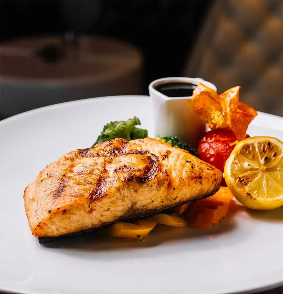 Grilled Mediterranean salmon fillet with lemon and herbs