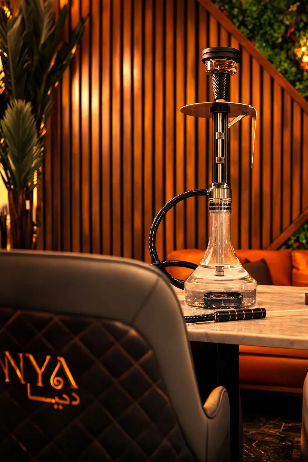 Premium glass hookah with warm ambient lighting at Dunya Lounge San Diego
