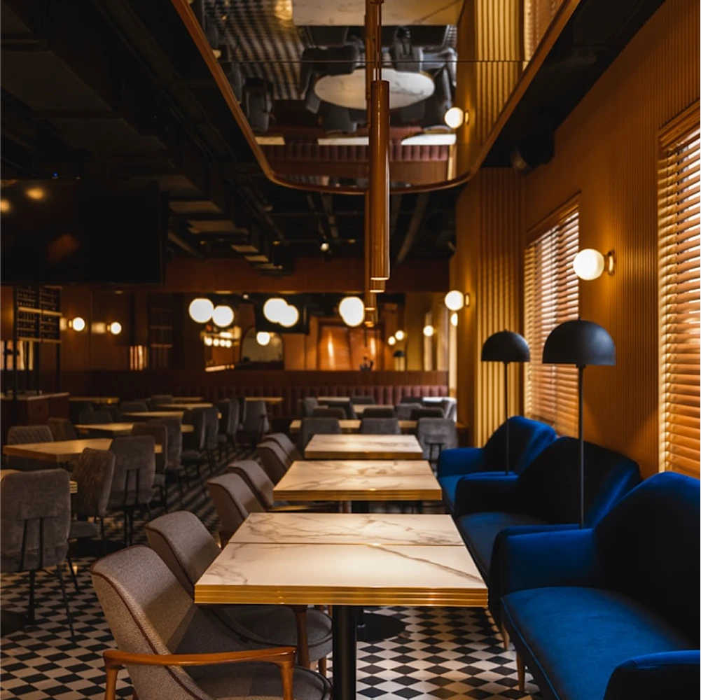 Dunya Lounge interior with marble tables, velvet seating and warm ambient lighting