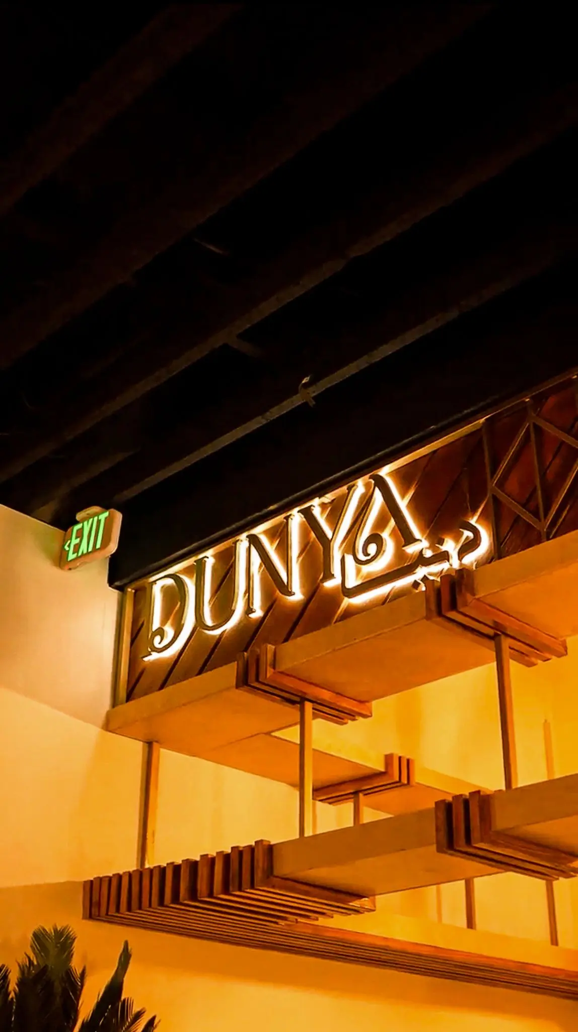 Dunya Lounge neon signage glowing in the lounge atmosphere